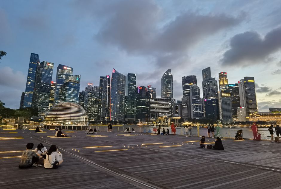 Stunning Singapore skyline with iconic Marina Bay Sands at dusk, capturing vibrant city life.