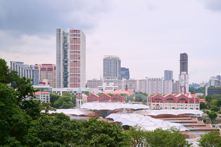 Explore the urban skyline of Singapore with its modern buildings and lush greenery.